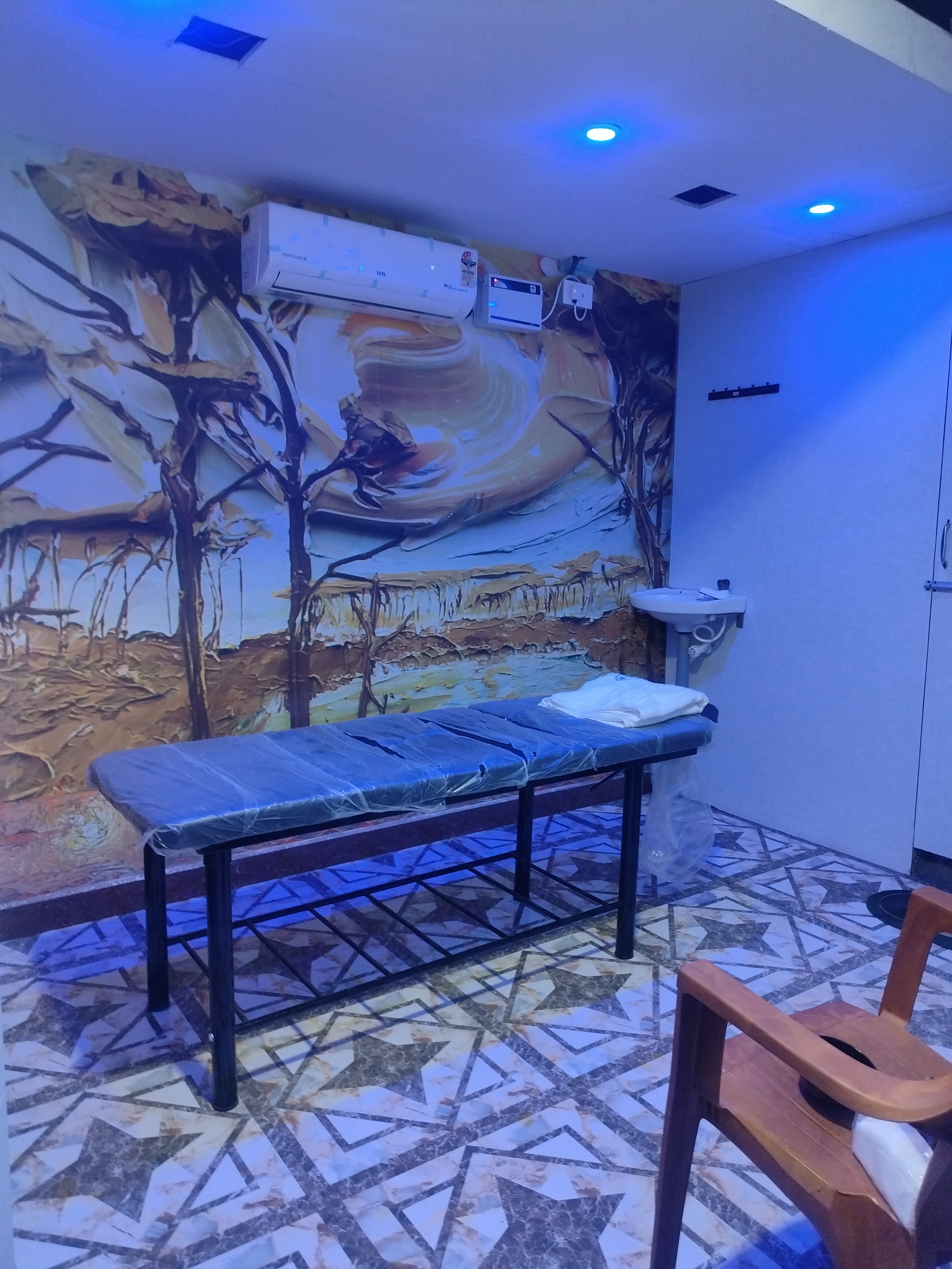 Massage bed and towel at Harmony Ayurvedic Care and Spa